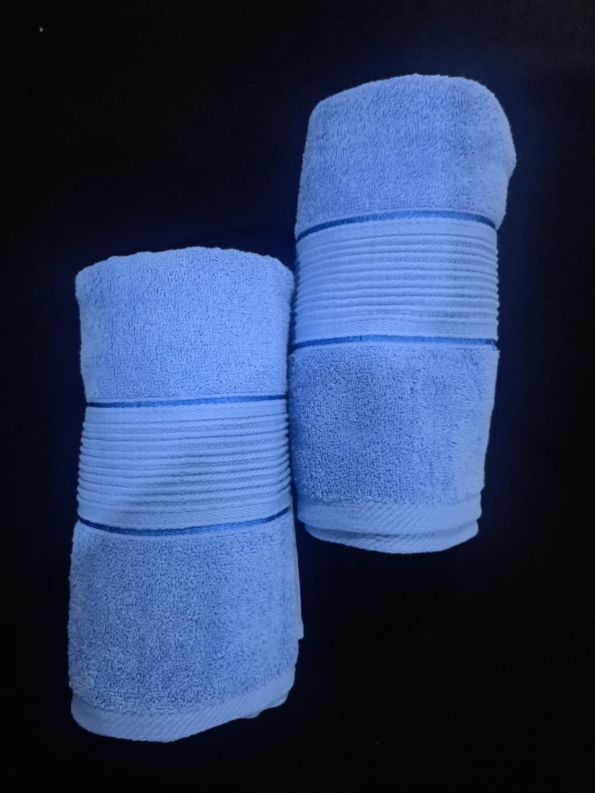 blue towels rolled together placed