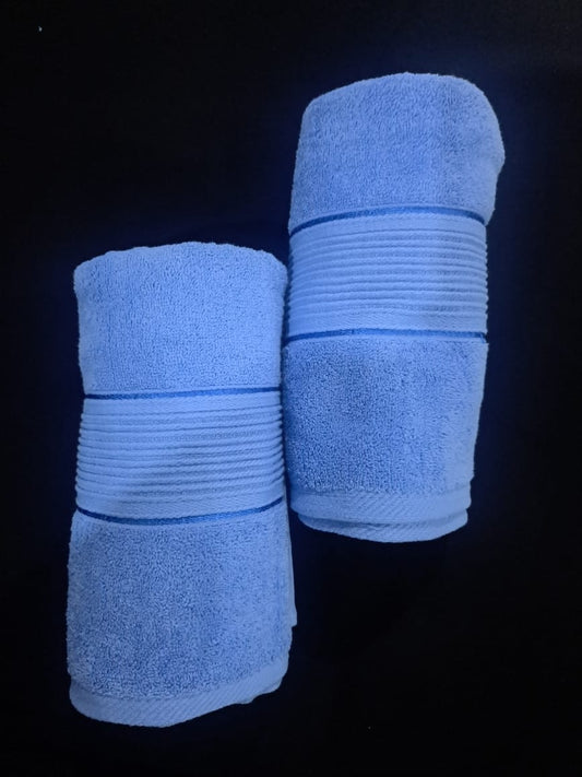 blue towels rolled together placed