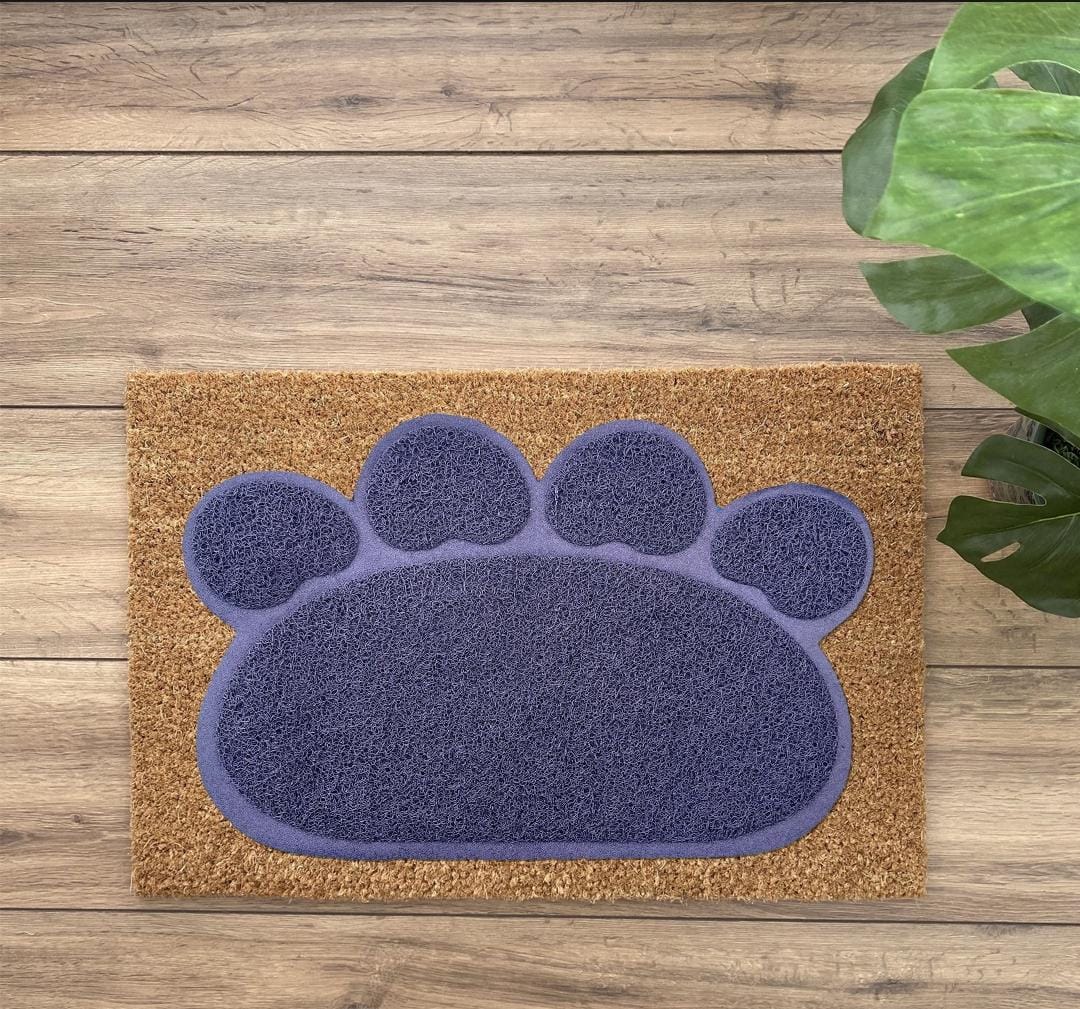Doormat with a purple paw print design on a wooden floor