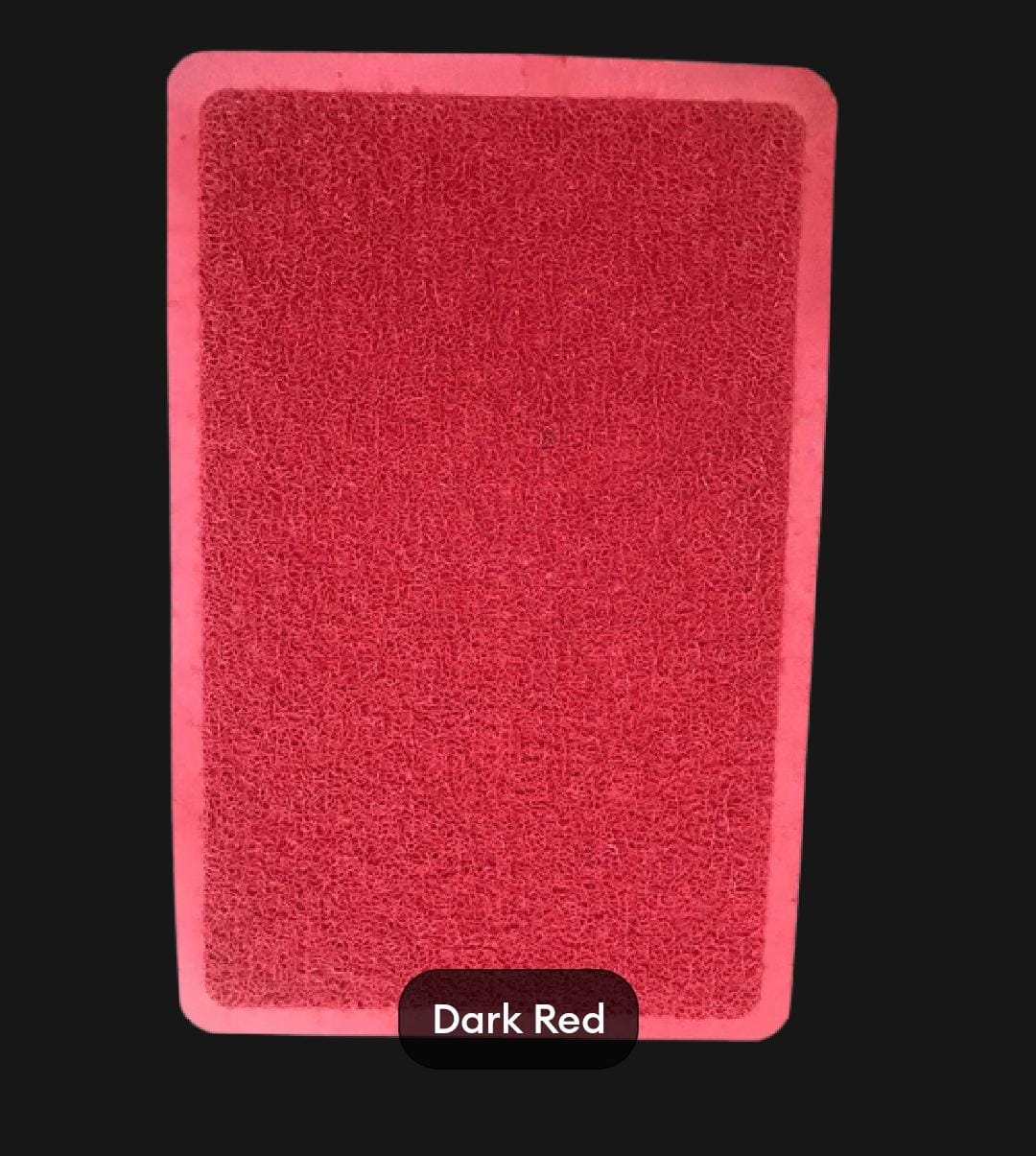 Dark red rectangular mat on a black background