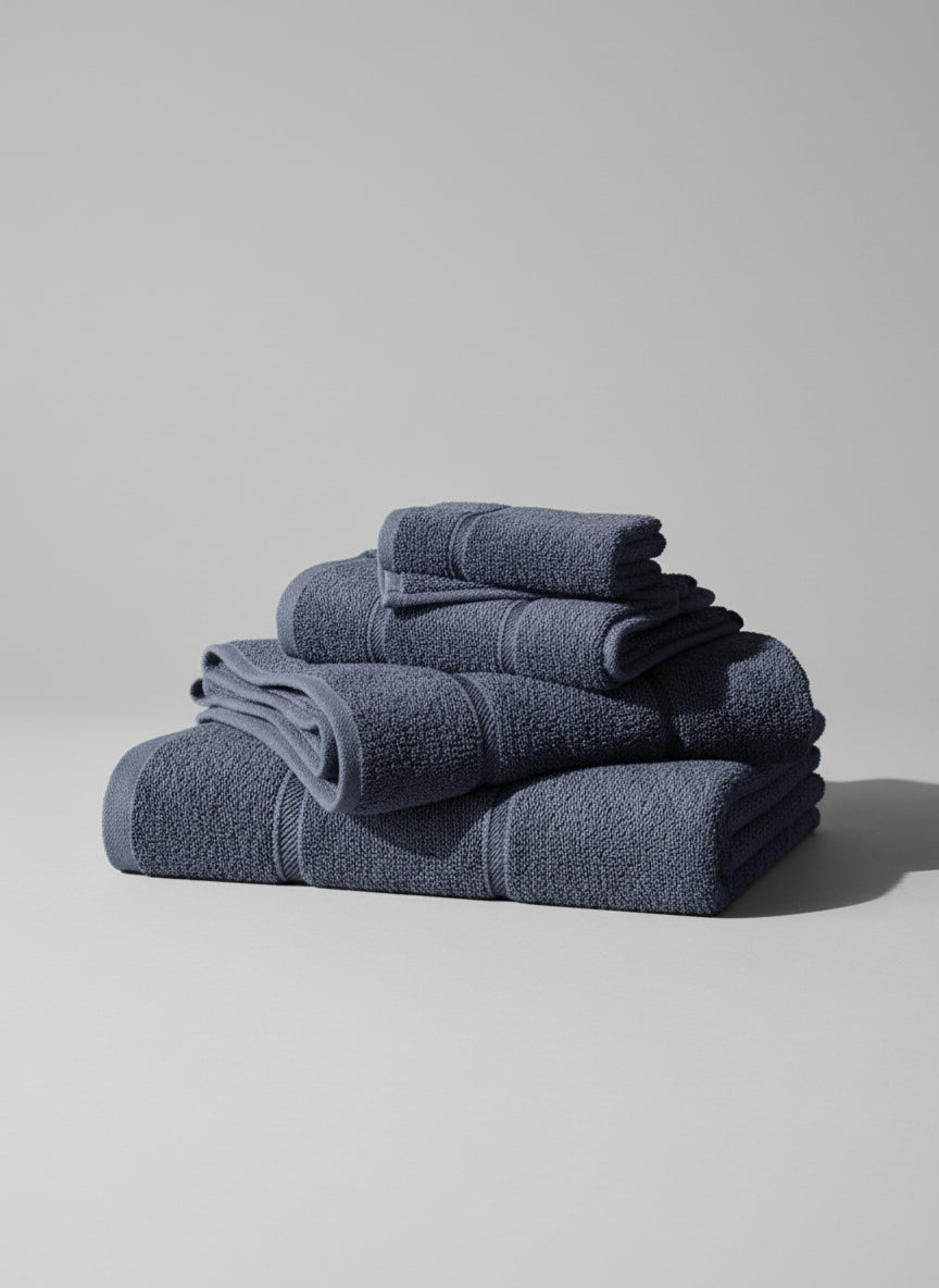 Blue towel on a cardboard box with a tiled floor background