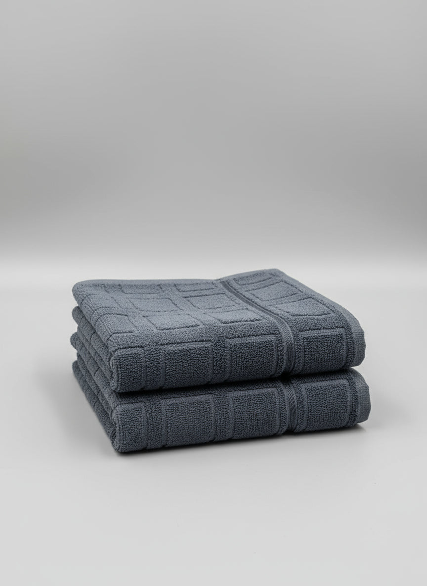 Gray towel with a checkered pattern on a cardboard box