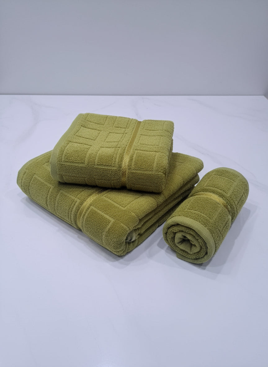 Set of green towels on a white background