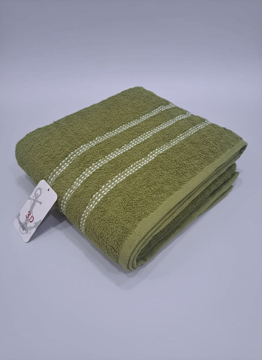 Green towel with white stripes on a wooden board against a tiled floor background