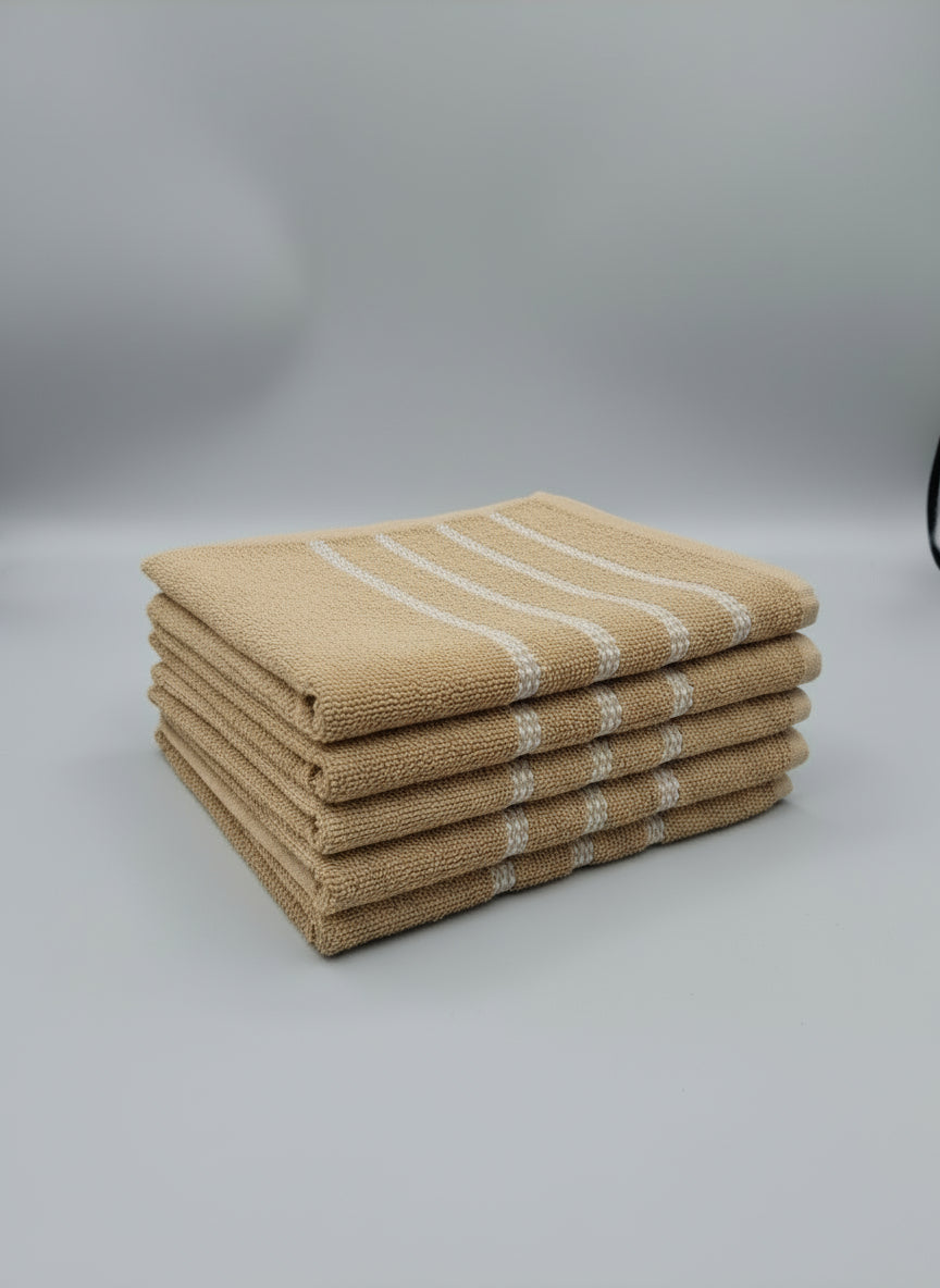 Beige towel with white stripes on a tiled floor