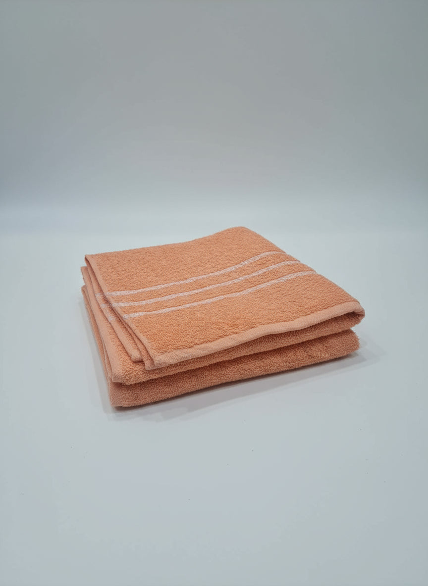 Orange towel on a tiled floor
