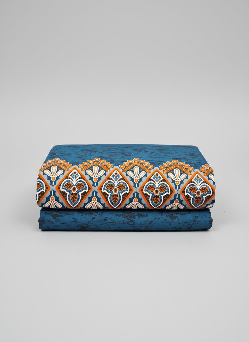 Blue fabric with white floral patterns and orange accents