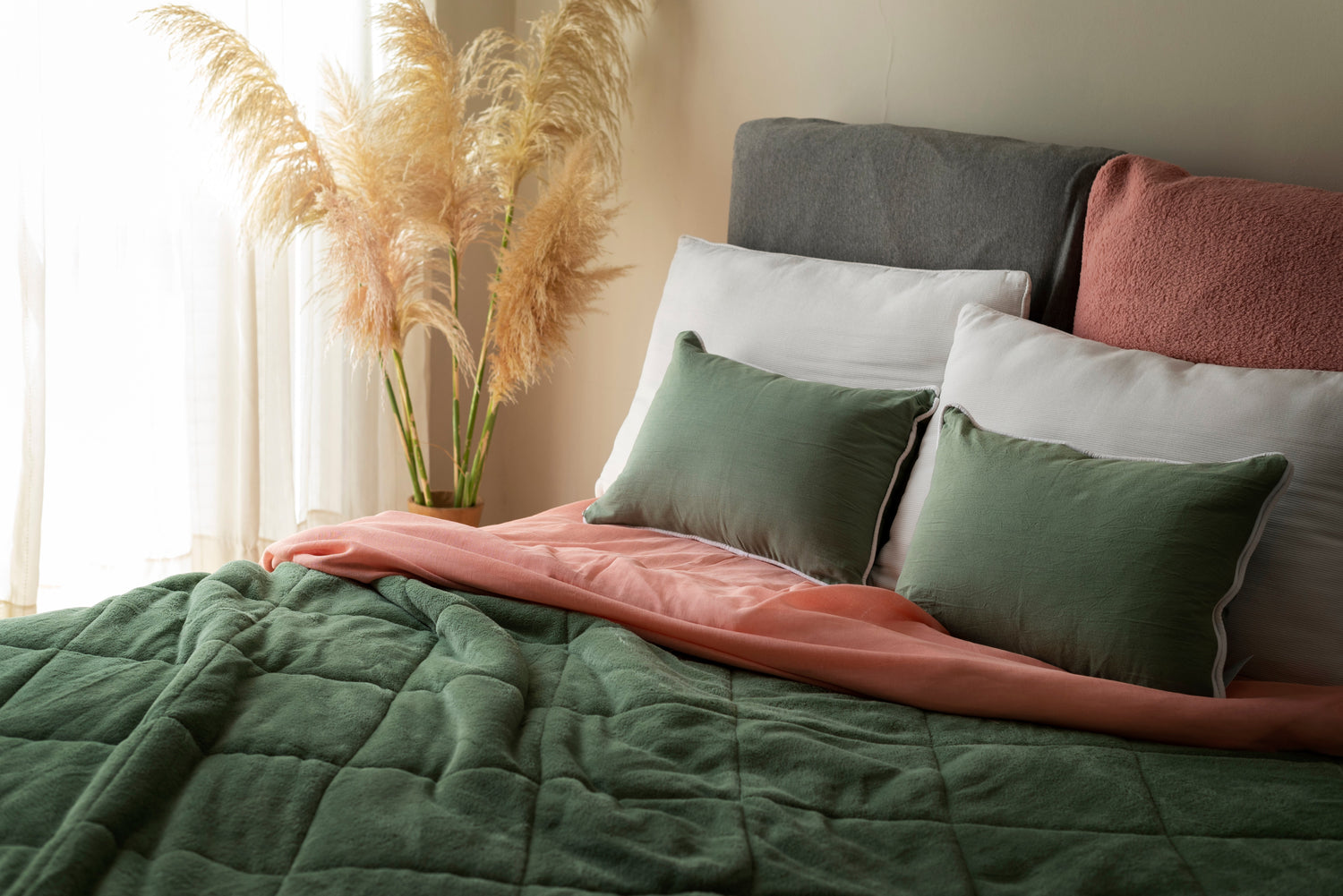 bed with two green pillows