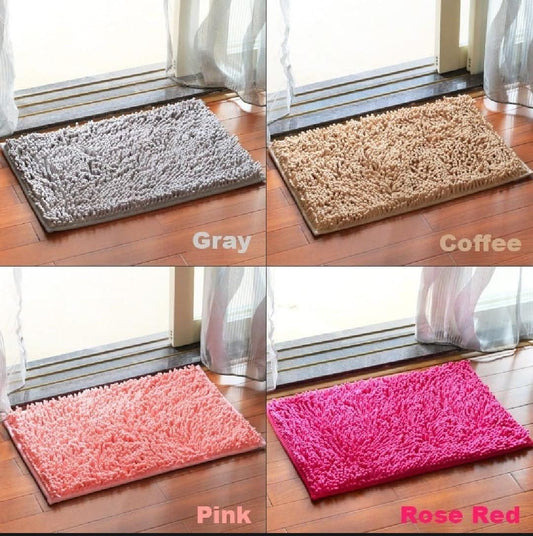 Four different colored bath mats (Gray, Coffee, Pink, Rose Red) on a wooden floor.