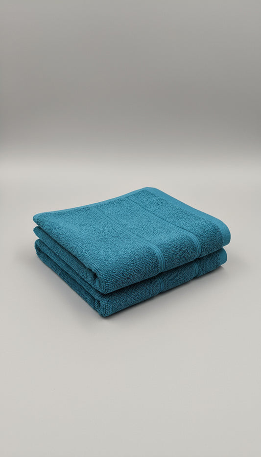 Close-up of a blue towel with a dark background