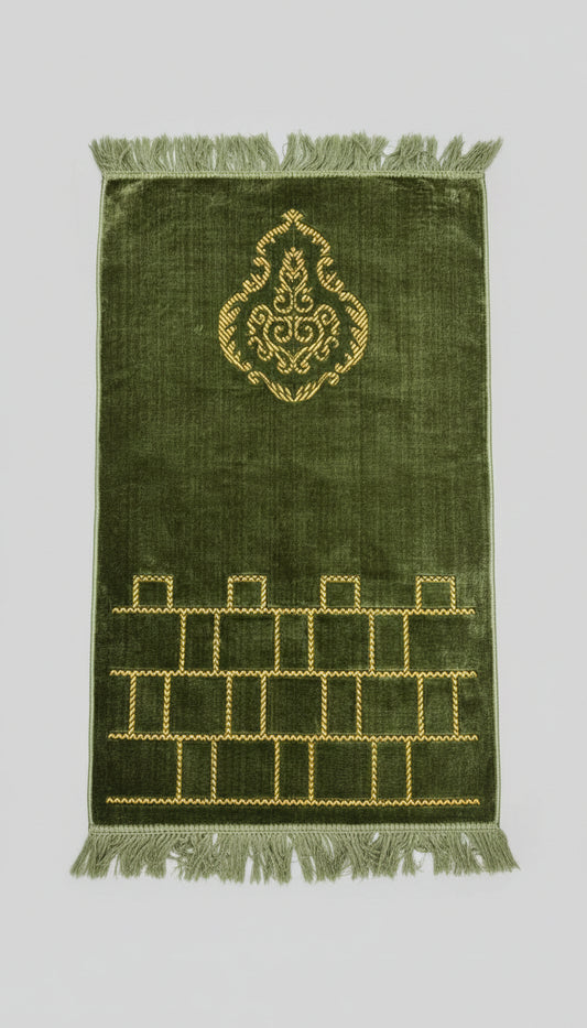 Green prayer mat with gold embroidery and patterns