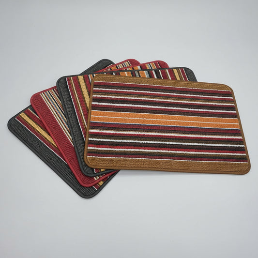 Stack of striped fabric swatches on a dark background