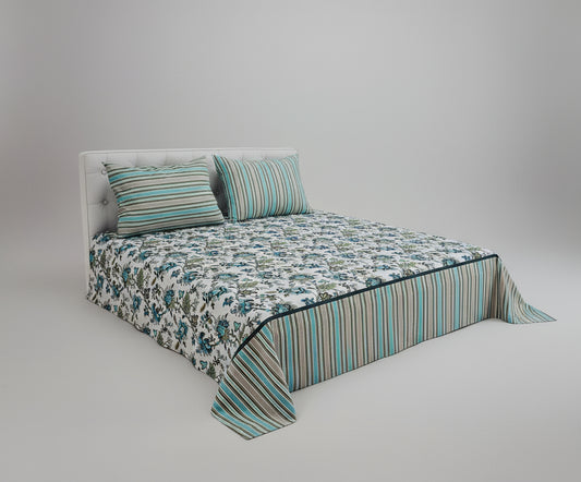Floral bedspread with striped edges on a bed, product by ROOMA.