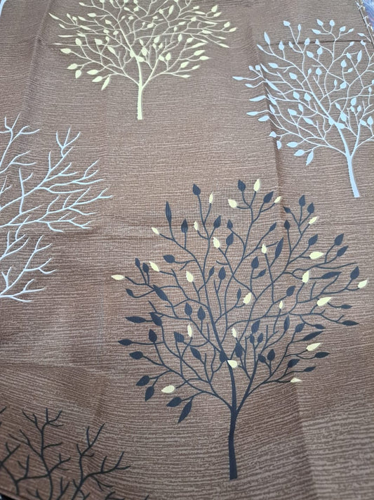 Brown bed sheet with tree design top view
