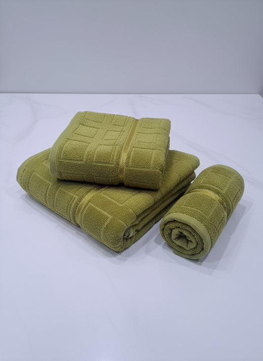 Set of green towels on a white background