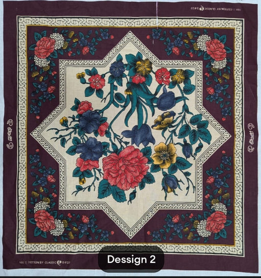 Floral patterned fabric with a geometric border on a maroon background