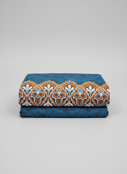 Blue fabric with white floral patterns and orange accents