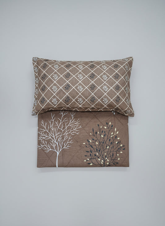 Brown single bed sheet with pillow close up 